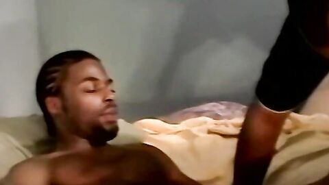 Amateur black guy jerks off solo with white dude kissing him